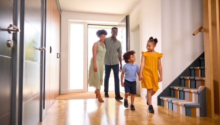 Family Walking Into Clean Home Family Walking Into Clean Home
